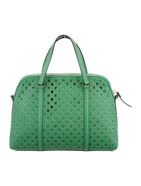 kate spade perforated leather handbags.